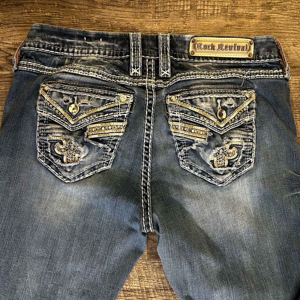 Rock Revival Distressed Blue Jeans with Gold Accents